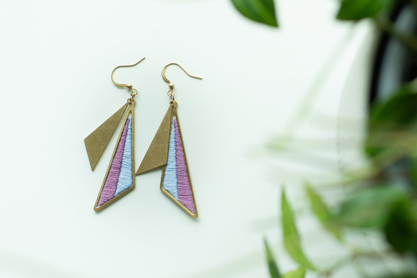 Geometric earrings with purple and blue triangles