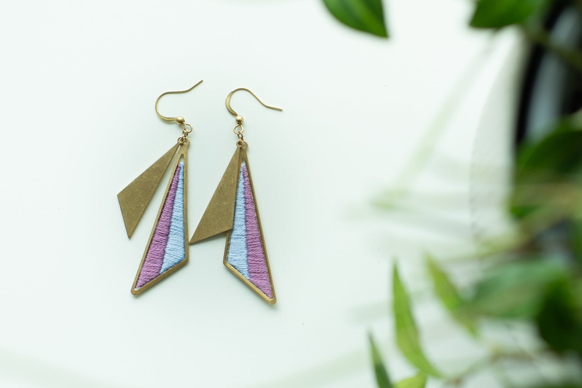 Geometric earrings with purple and blue triangles